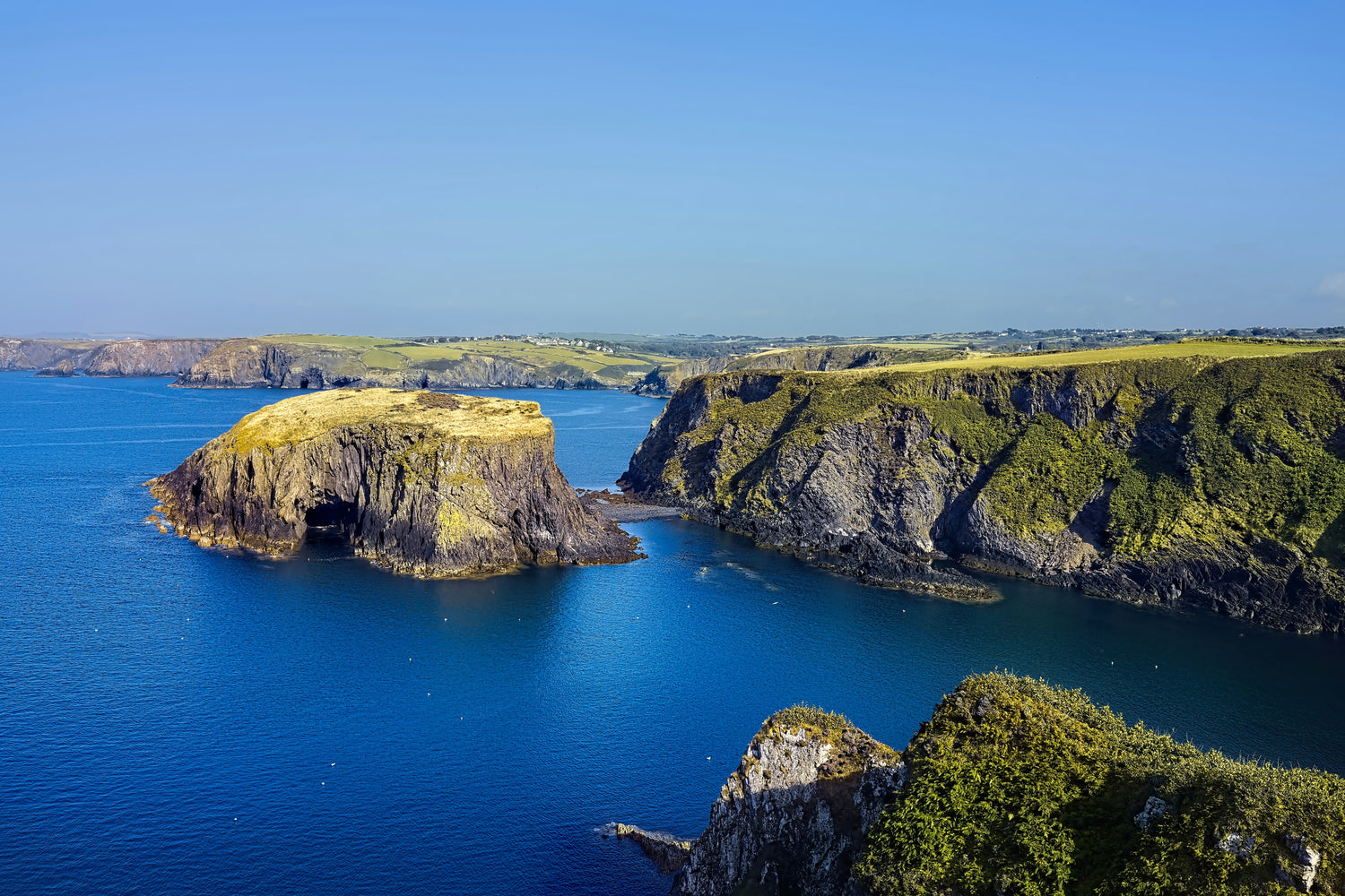 a-large-body-of-water-surrounded-by-mountains